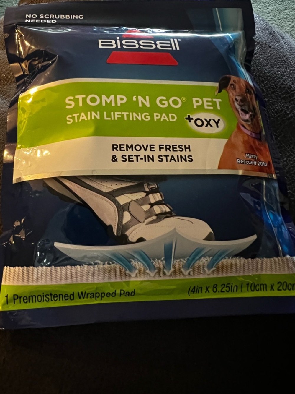 Bissell Blue and Green Stomp 'N Go Pet Stain Lifting Pad.